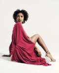 Model wearing the Signature Draped Long Top in fuchsia pink, featuring a draped silhouette and open back. Made-to-order in the UK.